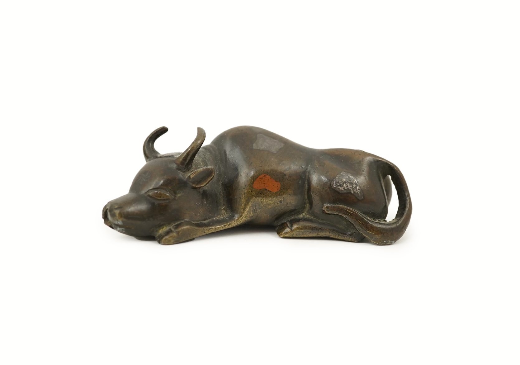 A Chinese bronze and mixed metal buffalo scroll weight, 19th century